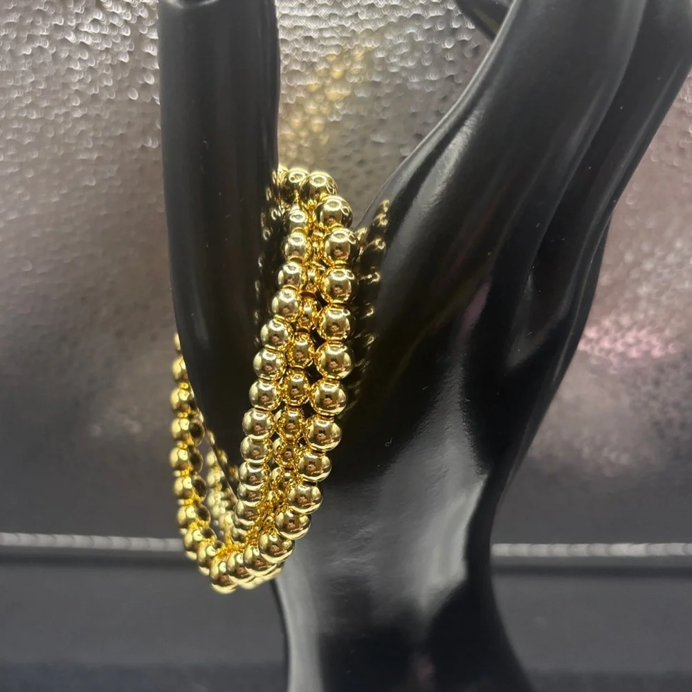 Elegant Gold Beaded Bracelet with Floral Accent